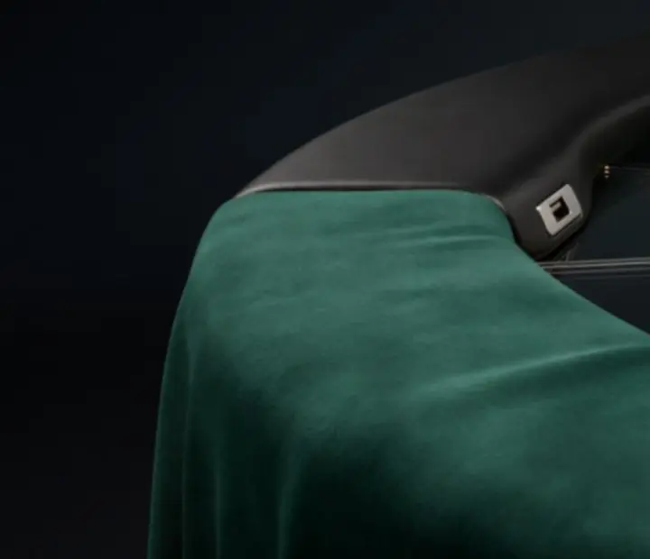 Detail of poker table technology with speed cloth, cup holders and subtle lighting